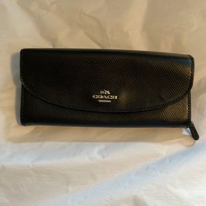 Black coach snap closure waller. Inside zipped area and card slots -gently used